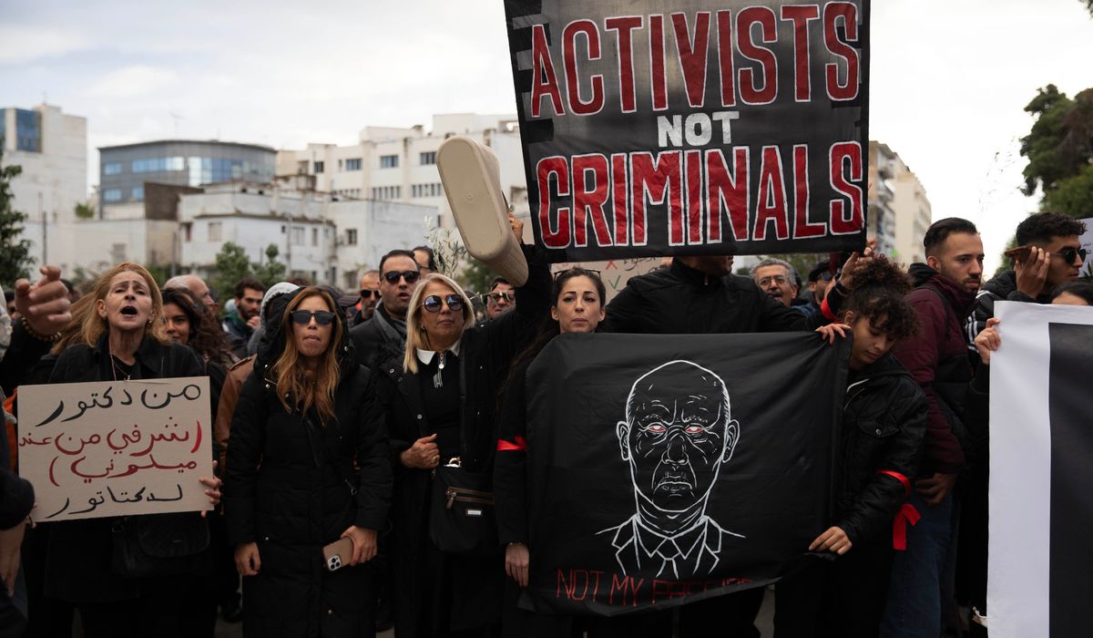 Tunisian police detain human rights defender as sweep against critics widens
